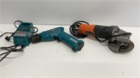 Makita electric drill with charger and plug in