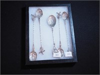 Four highly decorated 7" long 830 silver spoons