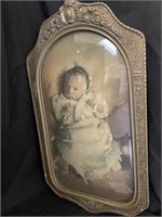 ANTIQUE CURVED GLASS FRAME W/ BABY PHOTO -