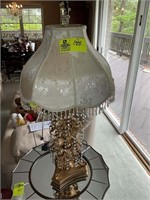 Gold colored table top lamp 35 in tall
