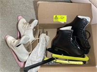Cardboard box containing Ice Skates. Black skates,