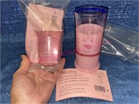 (2) New Pampered Chef pink measuring cups