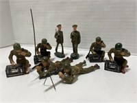 4 Toy Soldiers dressed in camouflaged fatigues and