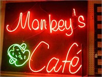 Neon monkey's cafe sign