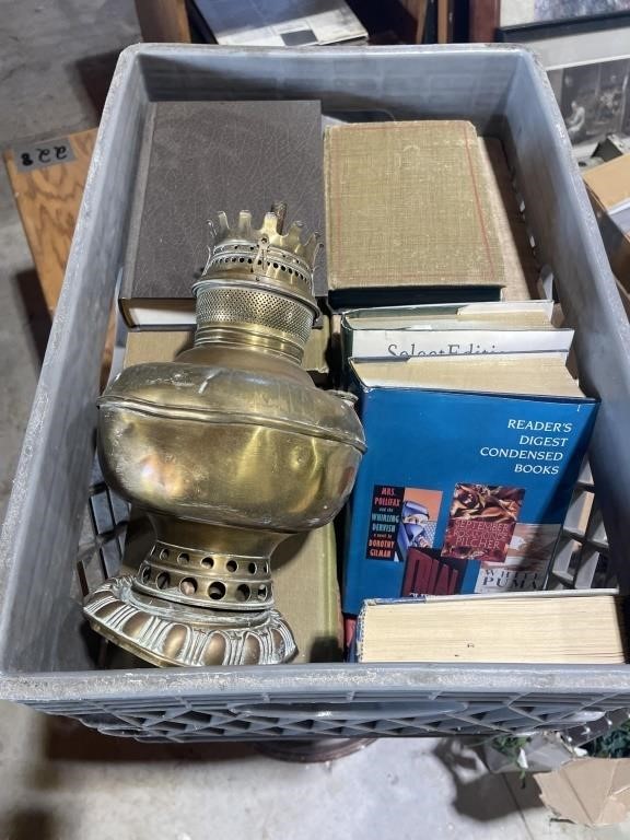 Crest of books with old lantern