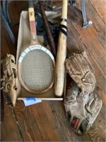 Box of bats and baseball mitts