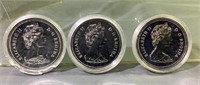 Three assorted Canadian silver dollars