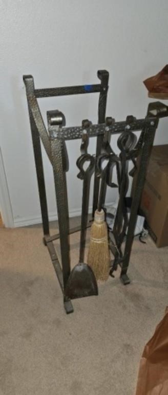 Metal fireplace pokers and law holders