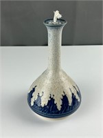Pottery oil lamp marked AP