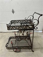 Beautiful antique style metal rolling tea cart.