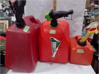 3 Plastic Gas Cans; (2) 5 Gallon & a 1-1/4 Gallon