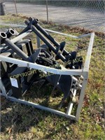 E. NEW SKID STEER AUGER WITH THREE BITS