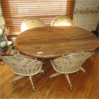 Dining room tabl & 4 chairs on casters