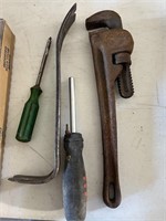 Pipe wrench, screwdrivers, pry bar