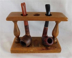 2 smoking pipes in maple stand -