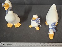 lots of 3 ceramic ducks 1 missing 1 red eye