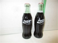 Two Vintage Full Coke Bottles