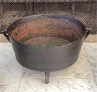 Cast iron three footed two handled pot measuring