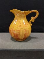 Yellow/orange pottery jug