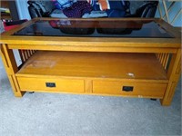 Coffee table with glass top. About 4"2' in