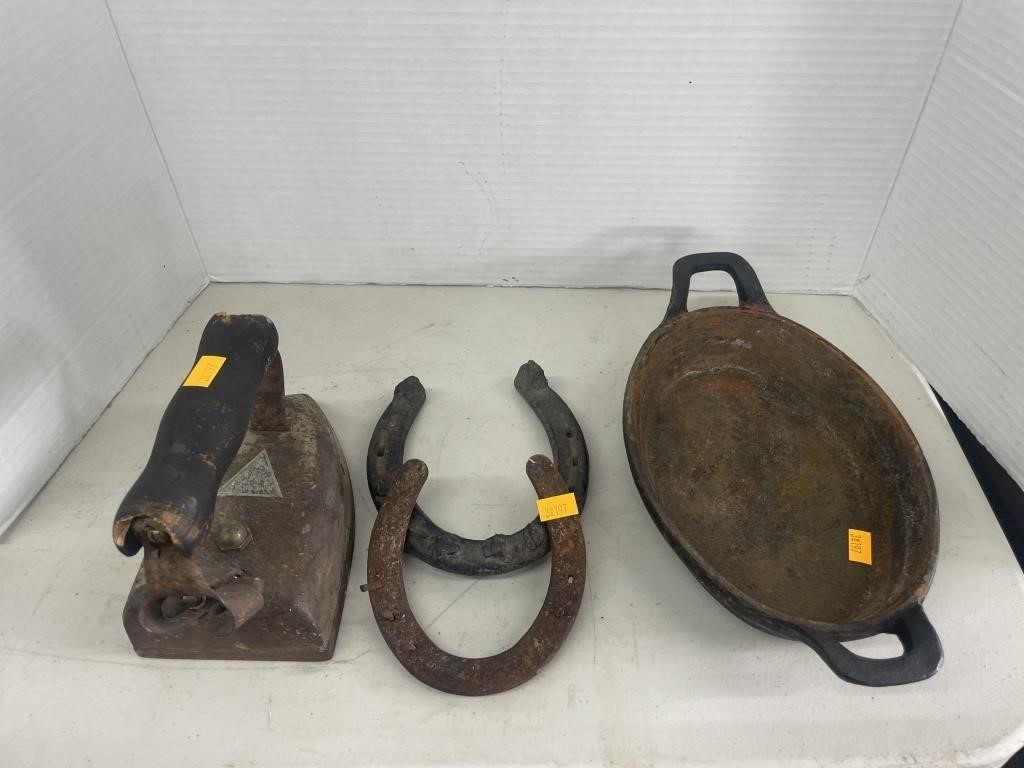 Vintage cast iron skillet, horse shoes and iron