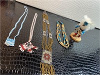 Beaded necklaces with prints & native figurine
