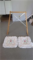 A MAKESHIFT QUILT RACK MADE OUT OF CRUTCHES AND 2