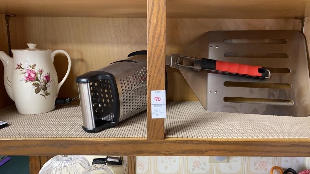 Shelf lot of grater, pizza peel, electric kettle