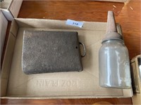 COW BELL AND OIL BOTTLE