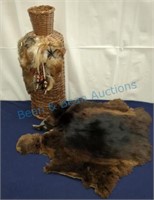 Wicker bottle cover and small animal pelt