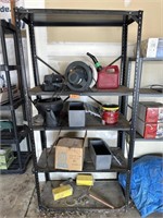 Metal shelf with misc items including car buffer
