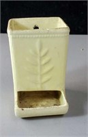 Yellow match holder with a crack