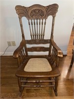 Carved Wooden Rocker with Cane Bottom