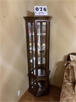 Corner curio cabinet approximately 6 foot tall.