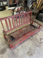 Wooden red porch swing