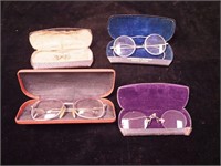 Four pairs of early eyeglasses in original