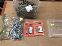 plastic box full of various metal and wood screws