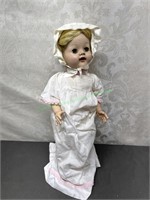 Baby doll with bonnet and white flowing dress