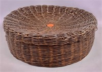 Wicker basket has concave lid, 12.5" dia., 4.5"