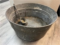 Large vintage metal wash basin and ladle