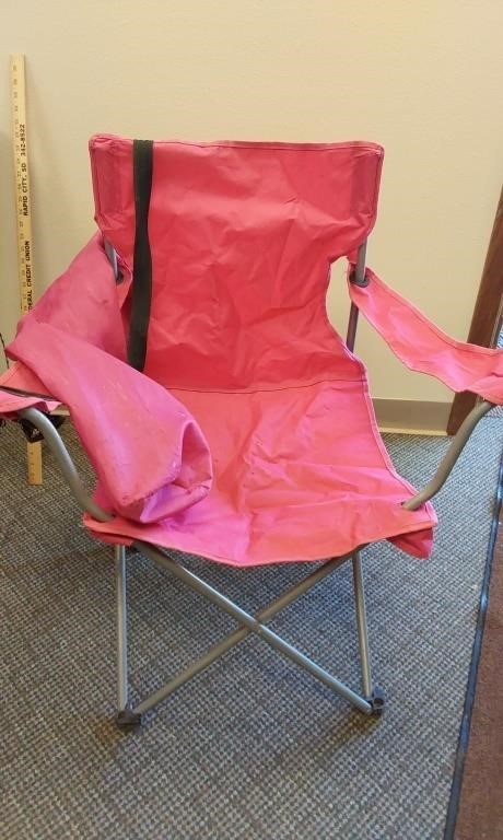 Pink camping chair. Does have a small rip. Few