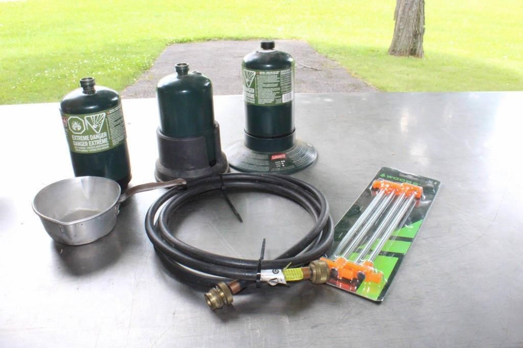 Three propane Coleman cylinders (2 with fuel),