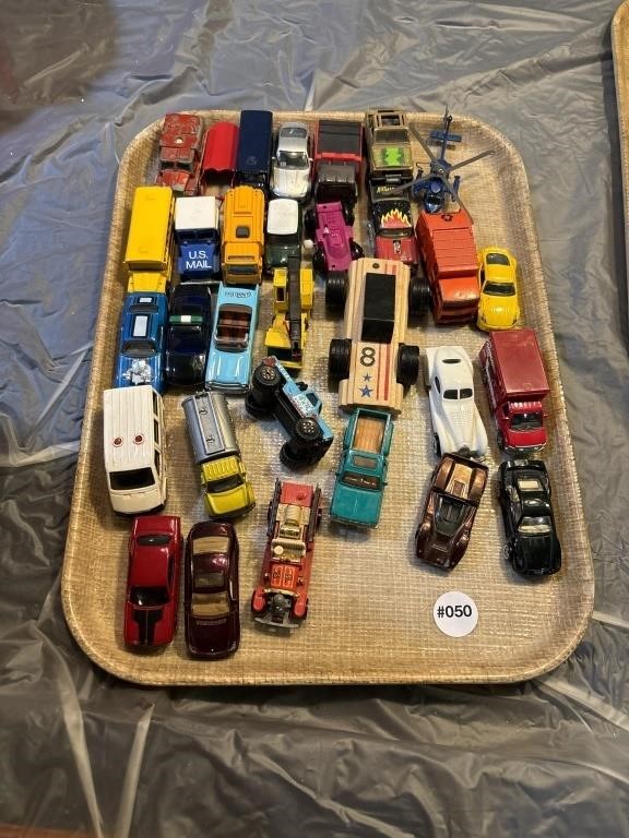 Grouping of toy cars, plus