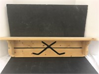 Wooden shelf and coat rack with hockey themed