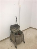 Rubbermaid mop bucket on casters. Comes with mop.