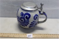 PRETTRY STONEWARE STEIN WITH BLUE FINGER PAINT