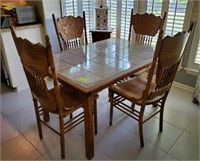 TILE TOP OAK TABLE AND 4 PRESSED BACK OAK CHAIRS