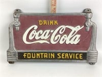 Painted cast iron coca-cola sign