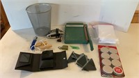 Paper cutter, alarm clock, trashcan, floor,