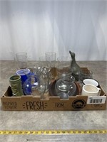Assortment of glasses, coffee mugs, and vases